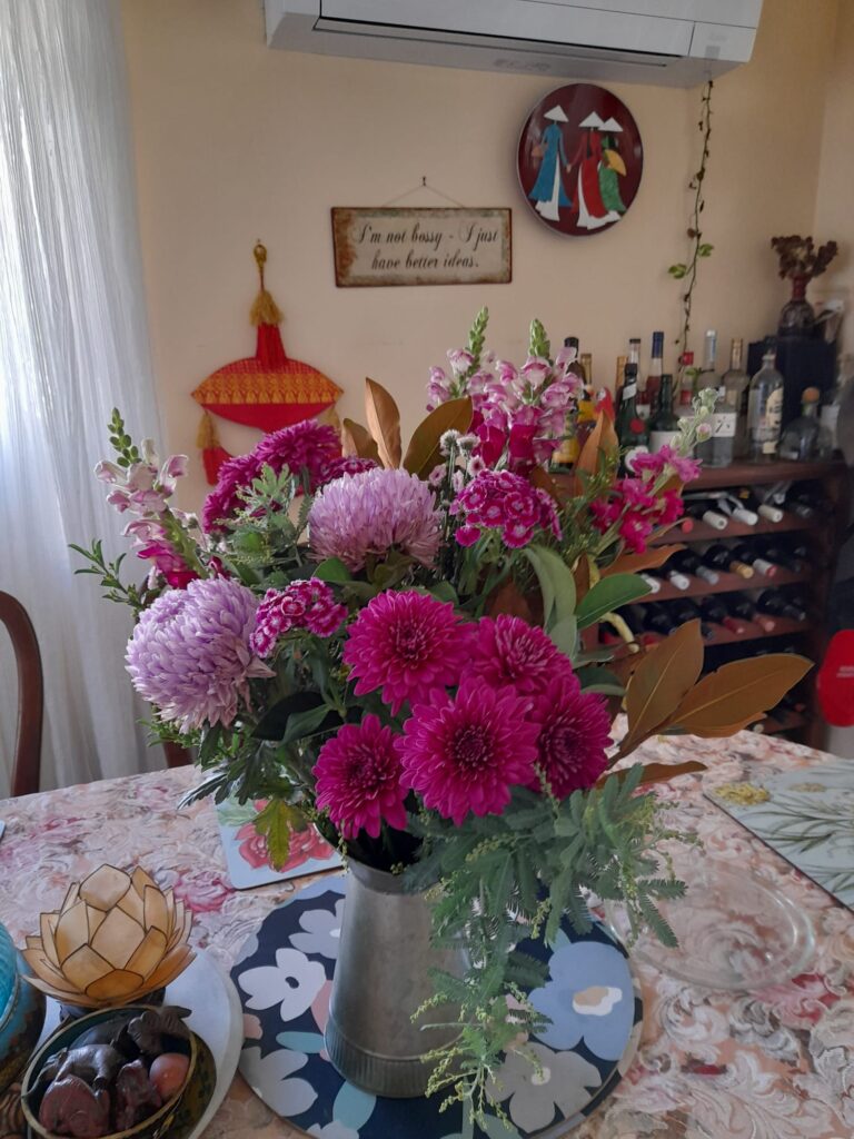 As a touching show of gratitude, the student presented me with a beautiful bouquet of purple flowers.